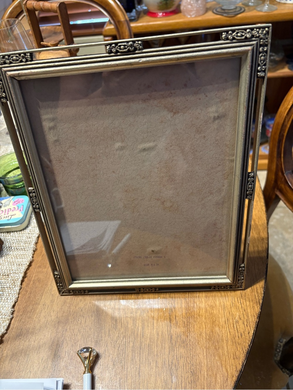 Vintage Art Deco gold tone metal frame. 8 x 10” good condition